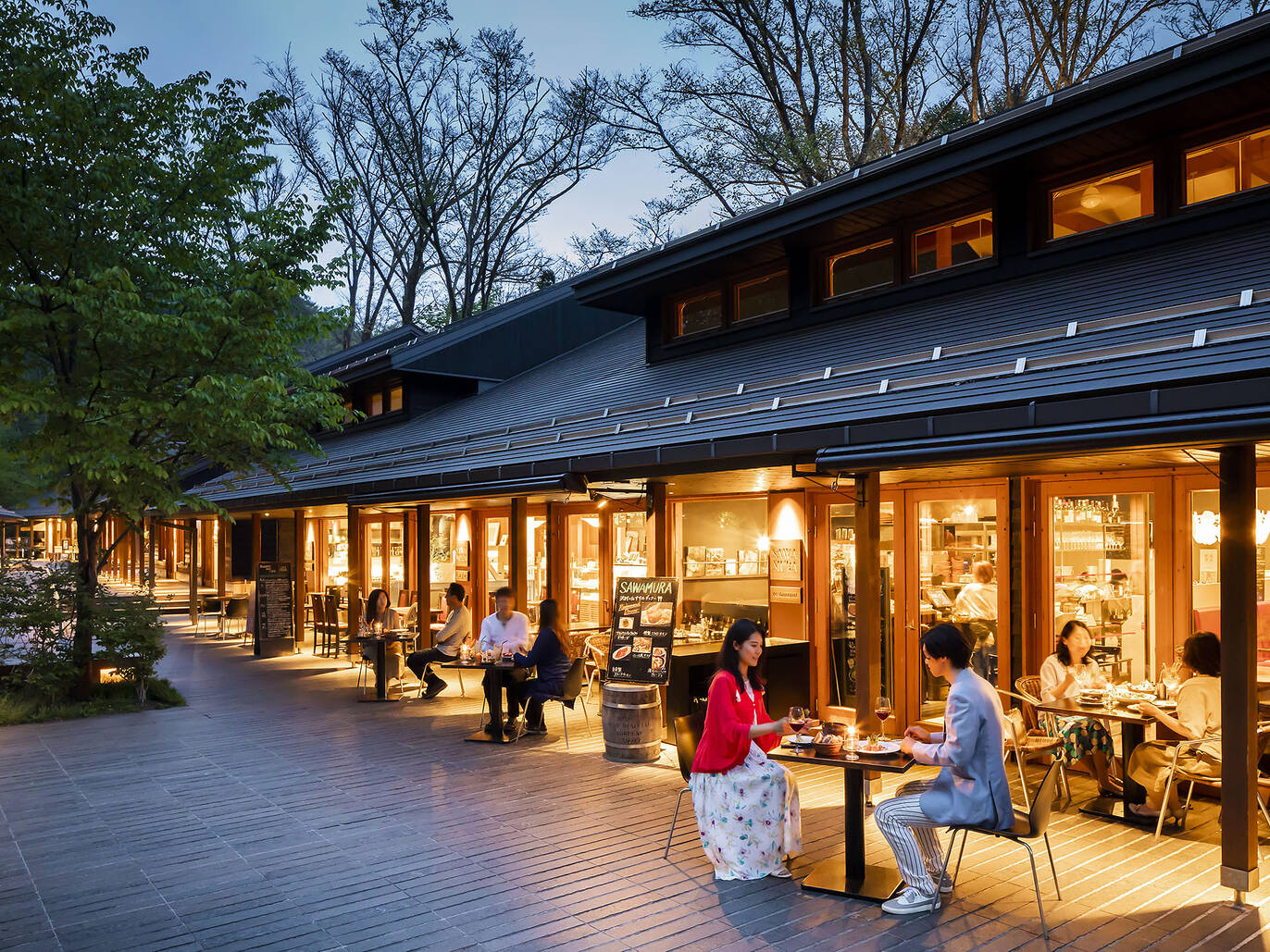 "Image of Harunire Terrace, a picturesque shopping and dining complex located in Karuizawa, Japan. It features beautiful architecture, lush greenery, and a serene atmosphere, offering a unique shopping and leisure experience.