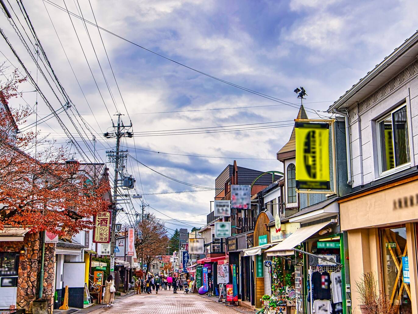 Image of Kyu-Karuizawa Ginza shopping street, a charming and lively shopping destination in Karuizawa, Japan. It showcases a quaint atmosphere, lined with shops, boutiques, cafes, and restaurants, offering a delightful shopping and dining experience.